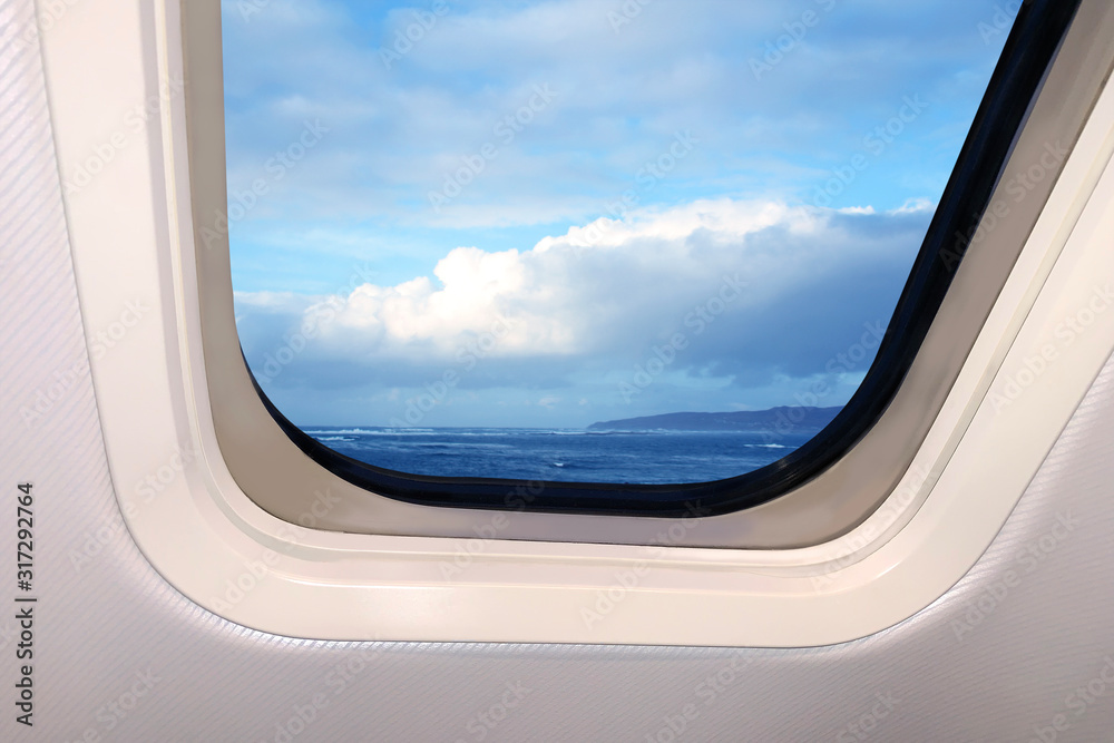 beautiful sky blue sky landscape with fluffy clouds behind the porthole of a plane, travel concept beautiful sky blue sky landscape with fluffy clouds behind the porthole of a plane, travel concept