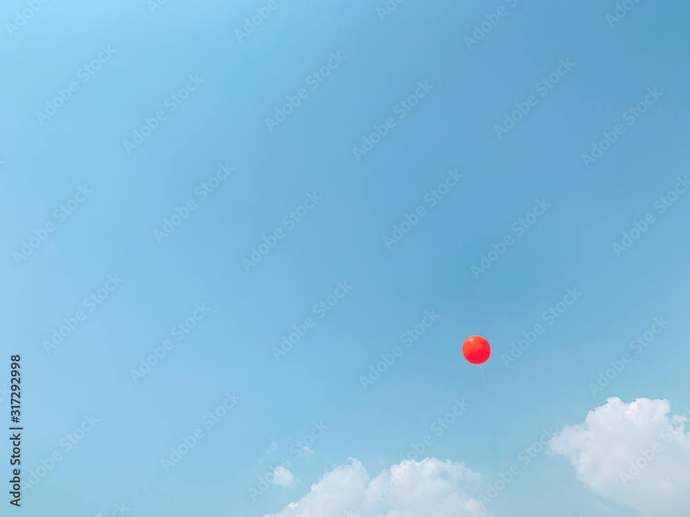 clear blue sky with orange balloon in summer balloon festival