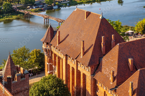 Aerial panoramic view of the monumental gothic Grand Masters’ Palace in the High Castle part of the medieval Teutonic Order Castle by the Nogat river in Malbork, Poland photo