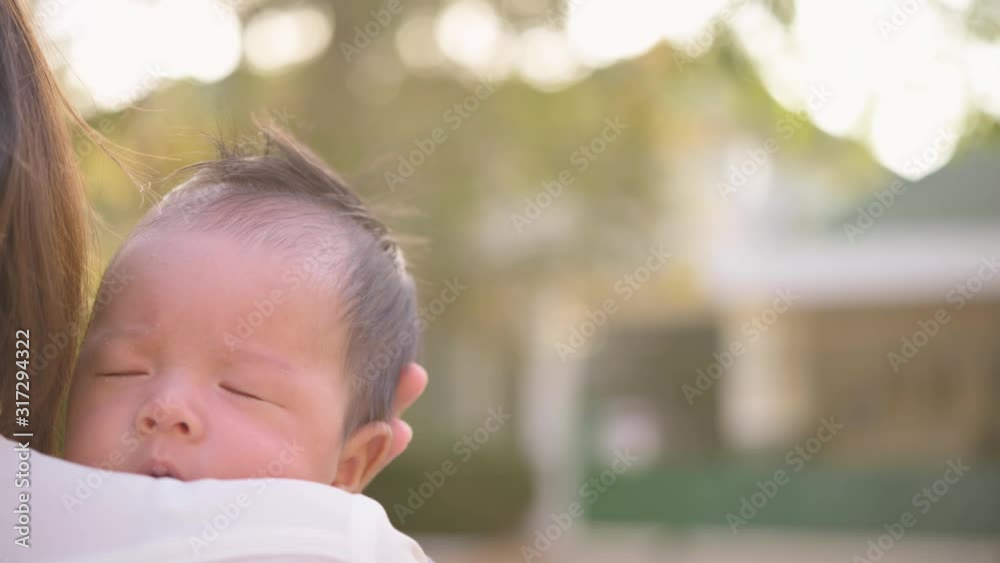 Slow motion, Mother holding her New born Baby boy and hugging. Maternity concept. Parenthood. Motherhood. Happy Family. Slow motion, Mother holding her New born Baby boy and hugging. Maternity concept. Parenthood. Motherhood. Happy Family.