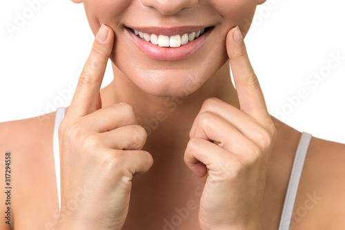 lip protection. isloated close up of a young woman beautiful smile, healthy lips and white teeth