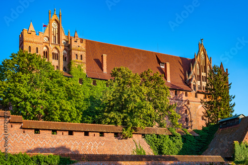 Panoramic view of the High Castle fortress defense walls and fortifications of the Medieval Teutonic Order Castle in Malbork, Poland photo