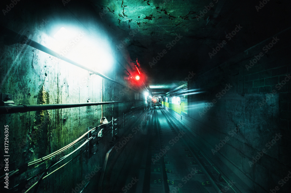 Dark underground tunnel. Grunge image with grain texture Stock Photo