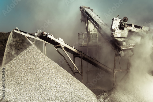 Industrial background with working gravel crusher