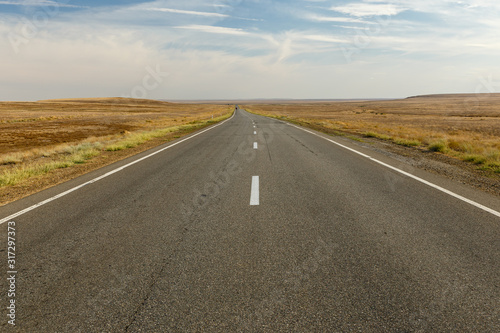 empty asphalt road across the steppe  Kazakhstan  Beautiful Road