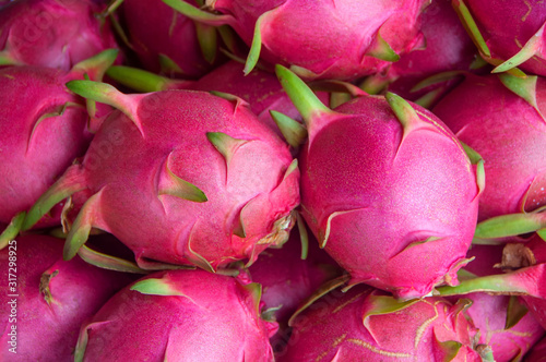 Fresh red-pink dragon fruit or pitaya background photo