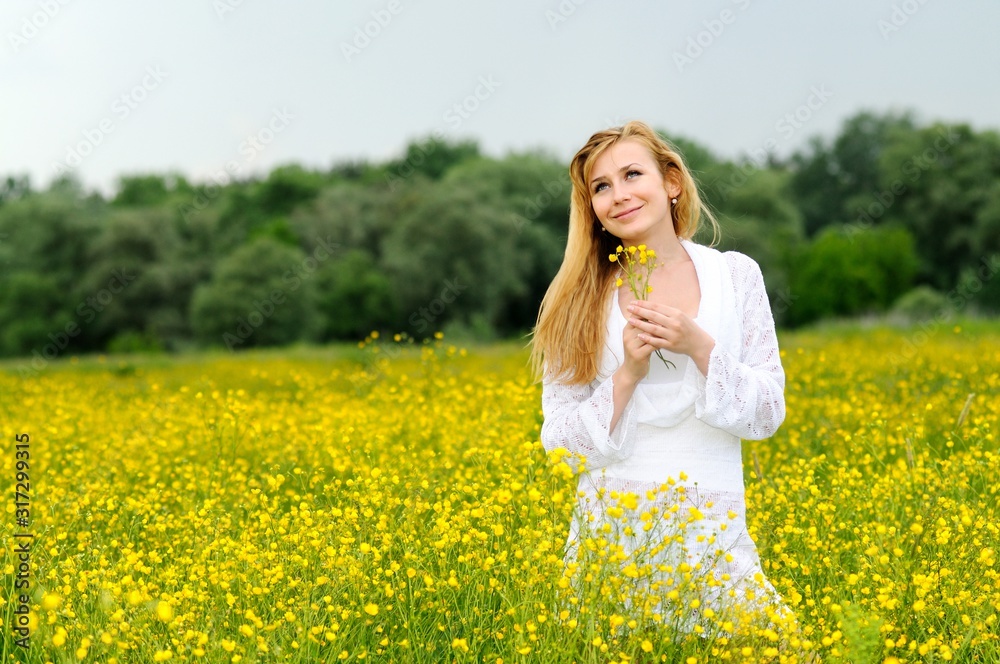 Young woman posing in a flower field Young woman posing in a flower field