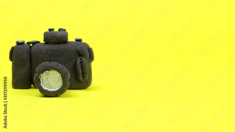 Pastry in the form of a camera on a light background. Space for text. Form for business cards, postcards Pastry in the form of a camera on a light background. Space for text. Form for business cards, postcards