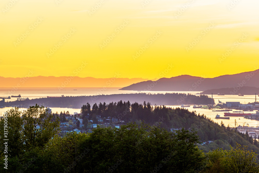 View of ocean sunset over mountains in beautiful British Columbia. Canada.