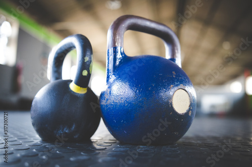 Fototapeta Naklejka Na Ścianę i Meble -  Close up image of kettle bell weights in a gym