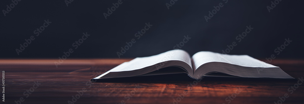 Fototapeta open book on wooden desk background