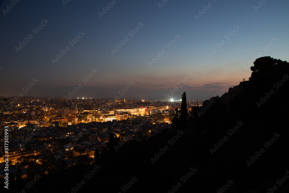 Night view of the city from Filopappos Hill in the evening, Athens, Greece