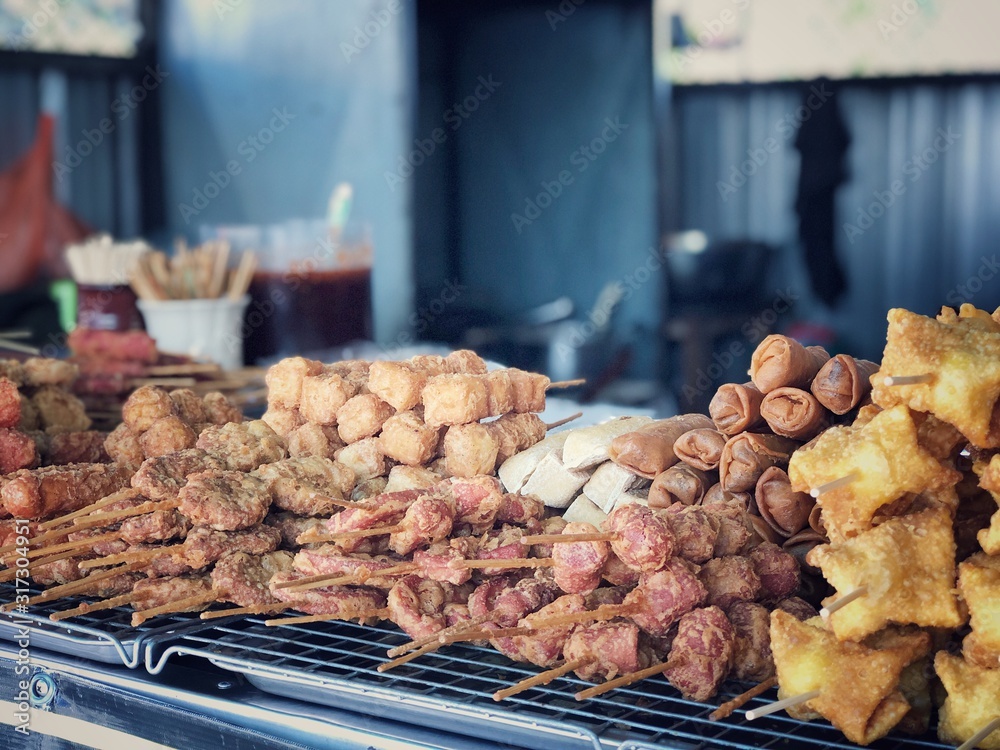 Fried sausages and deep-fried, meatballs,chicken meat, tofu are easy to eat but not high in carbohydrates and fats in market. Thai street food in Thailand.