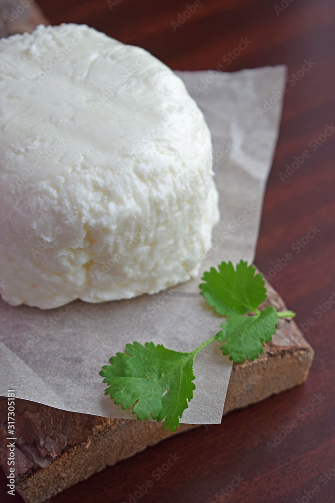 Homemade pickle cheese with a sprig of greenery on a wooden background. Homemade pickle cheese with a sprig of greenery on a wooden background.