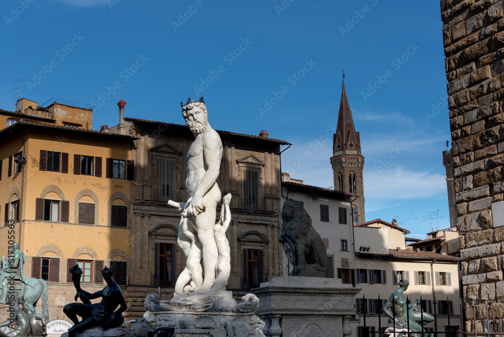 statues in front of the old building facade in Florence Tuscany