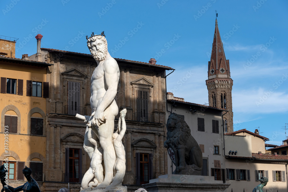 statues in front of the old building facade in Florence Tuscany