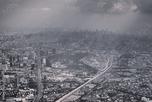 Air pollution over Bangkok, Thailand, aerial view. Urban sprawl, metropolis. Black and white color toned vintage effect.