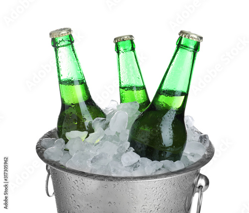Картината върху платно Beer in metal bucket with ice isolated on white