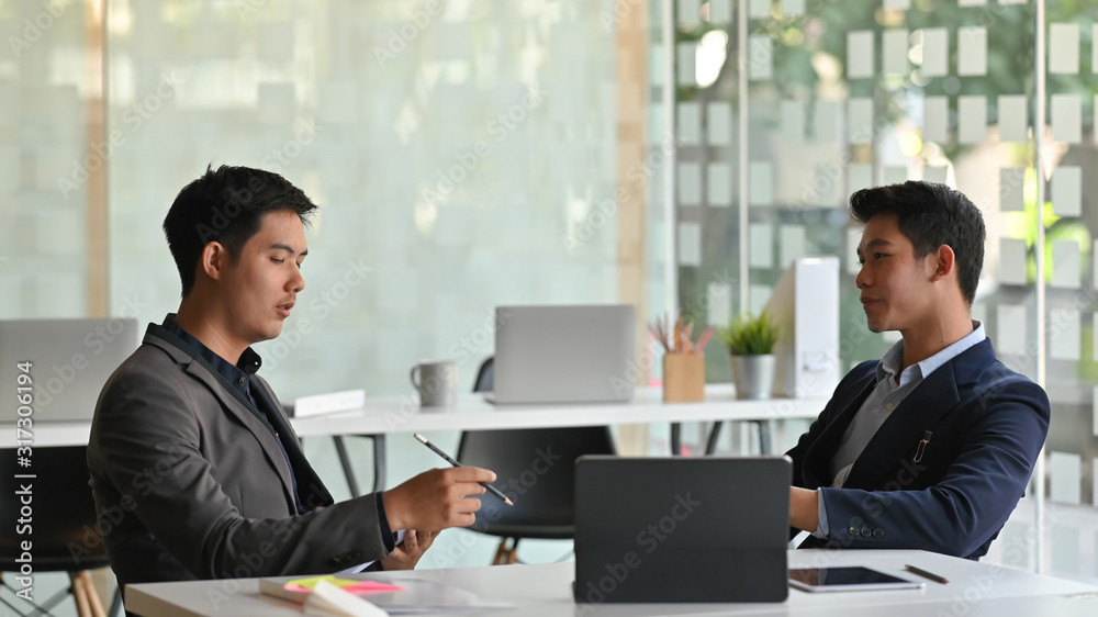 Photo of board of directors discussing about them business by using tablet and document at the modern meeting room. Photo of board of directors discussing about them business by using tablet and document at the modern meeting room.