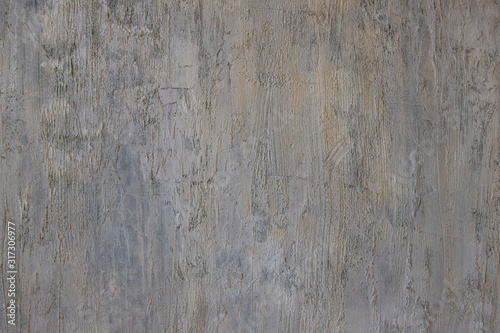Gray texture of the surface in the form of a vertically smeared stone