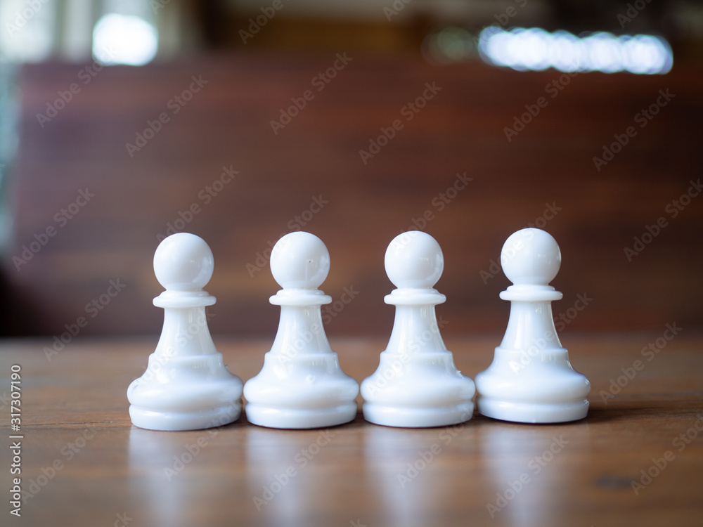Four white pawns,.Chess business idea for competition in world market, success and leadership concept. Four white pawns,.Chess business idea for competition in world market, success and leadership concept.