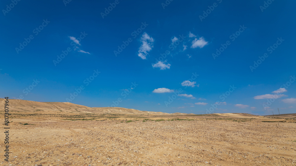 White panorama of desert with a white clouds