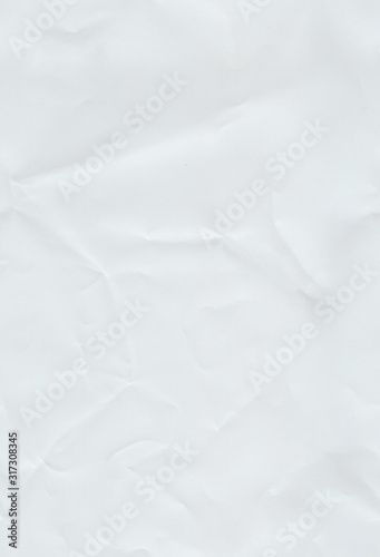 Slightly wrinkled paper. Seamless pattern with a white crumpled paper texture and stretched again.