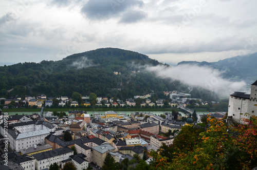 Top view of the Salzach river and the old city in center of Salzburg, Austria, from the walls of the fortress in cloudy autumn day 