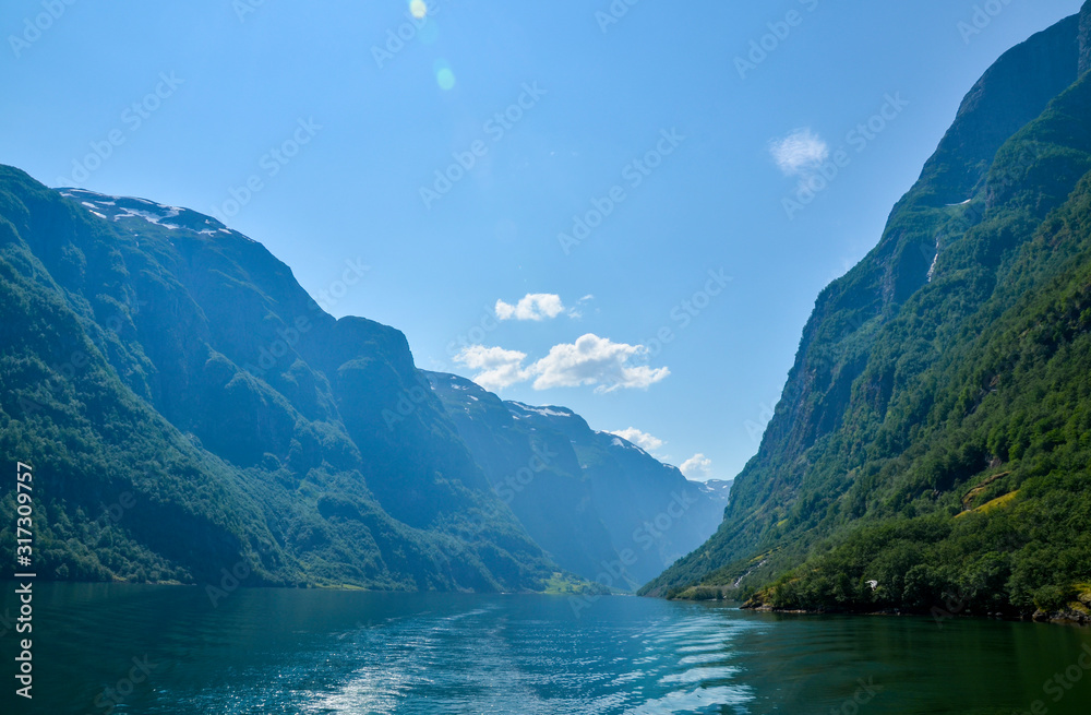 Fototapeta premium Beautiful view from the water on the Sognefjord near Gudvangen in the western part of Norway
