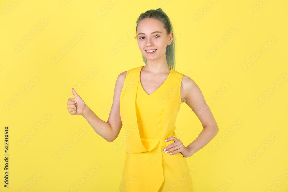 beautiful young woman in a yellow dress on a yellow background beautiful young woman in a yellow dress on a yellow background