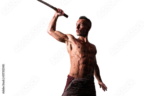 An athletic man, in blood, with a Japanese sword, strikes. Isolated on a white background.