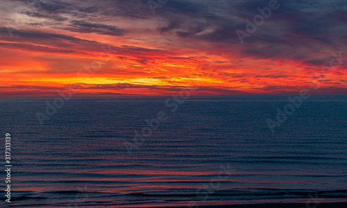 sea sunset landscape with colorful skies and dark water