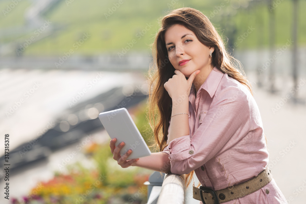 Young fashion woman using digital tablet computer Young fashion woman using digital tablet computer