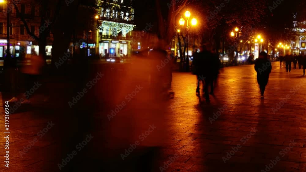 The movement of people along the boulevard night avenue. Time lapse. The movement of people along the boulevard night avenue. Time lapse.