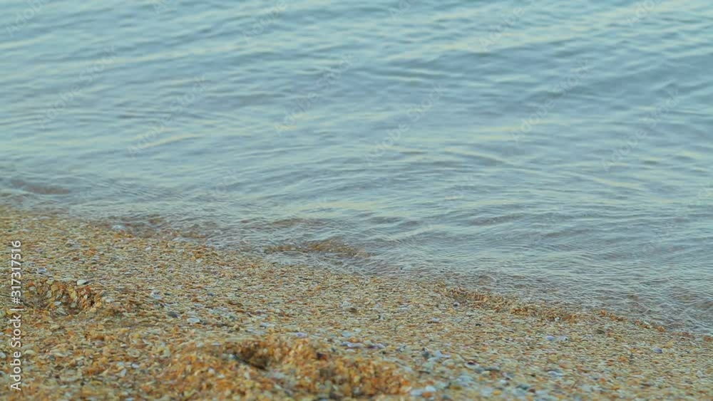 Sandy seashore and blue sea at dawn Sandy seashore and blue sea at dawn