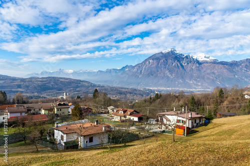 The view of the Dolomites Alps and the village, province Belluno, Italy