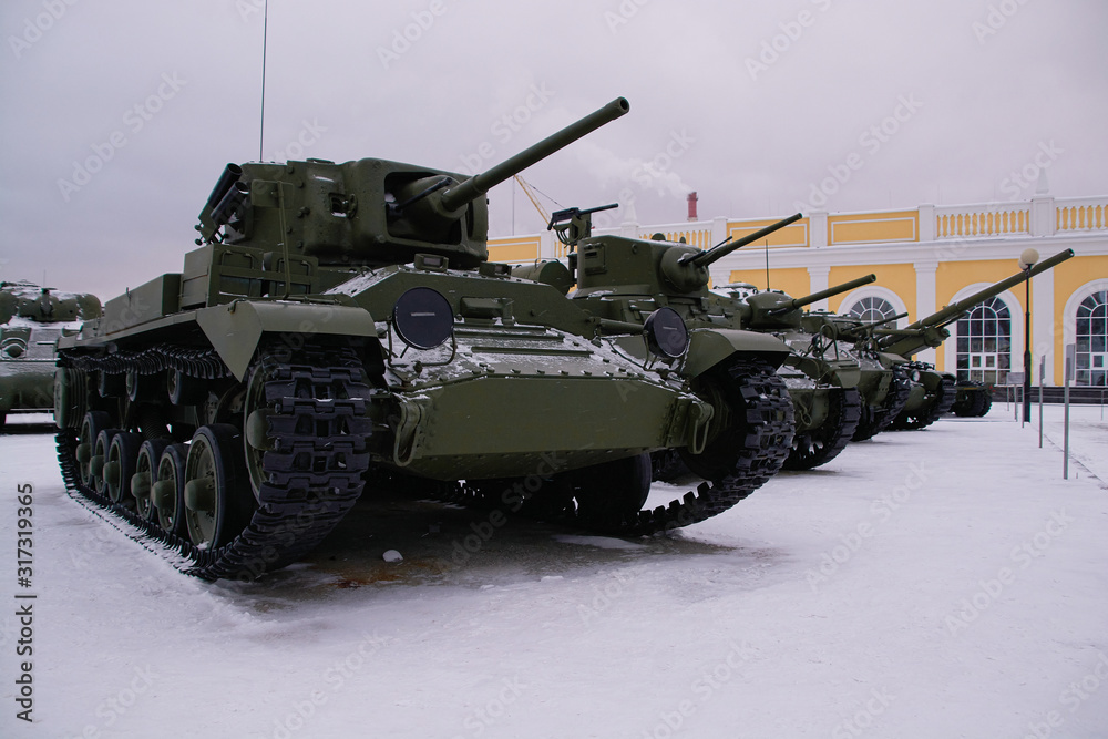 old military tank on a winter background