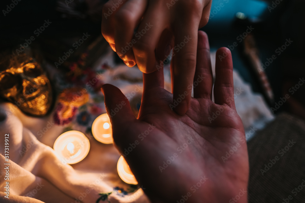 fortune telling in the palm of a hand in a dark room. palmistry concept fortune telling in the palm of a hand in a dark room. palmistry concept