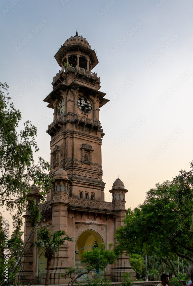 Fototapeta premium Clock Tower in Malka Park of Bulandshahr, Uttar Pradesh captured just before the sunset in the summertime