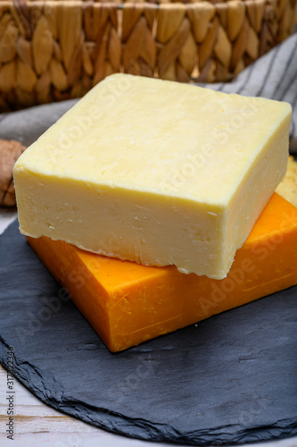 Leicestershire cheese or red leicester and mature cheddar, British hard cheeses made from cow milk
