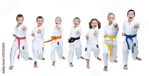 Seven athletes are beating a punch hand on a white background
