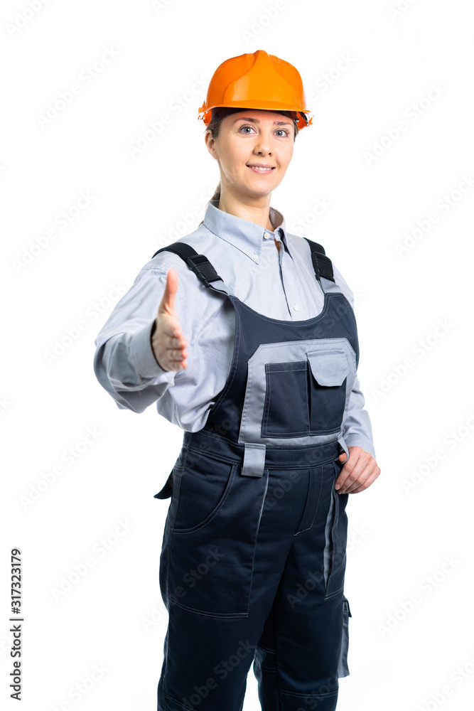 Young beautiful woman engineer in protection uniform doing handshake gesture. Isolated Young beautiful woman engineer in protection uniform doing handshake gesture. Isolated