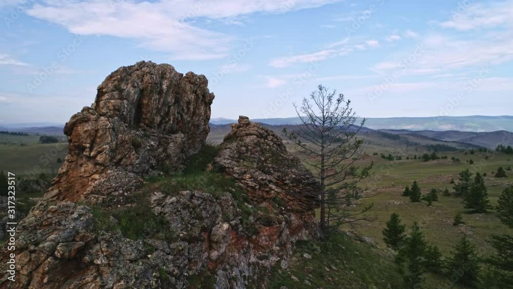 Baikal Valley spirits,Tazheran steppe, stone cliffs on the road. Aerial Summer Baikal Valley spirits,Tazheran steppe, stone cliffs on the road. Aerial Summer