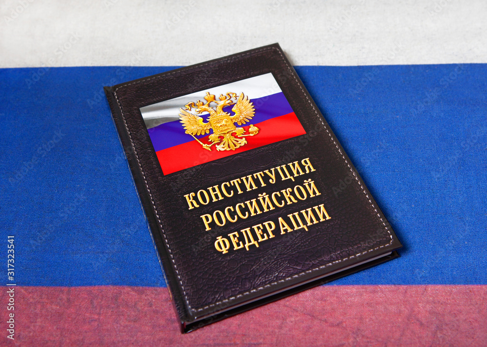 Book with the inscription Constitution of the Russian Federation, on the background of the tricolor. Book with the inscription Constitution of the Russian Federation, on the background of the tricolor.