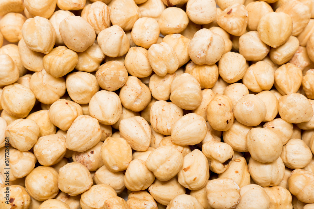 Whole hazelnuts background. Vegetarian healthy snack. Organic food. Vegetable diet. Whole hazelnuts background. Vegetarian healthy snack. Organic food. Vegetable diet.