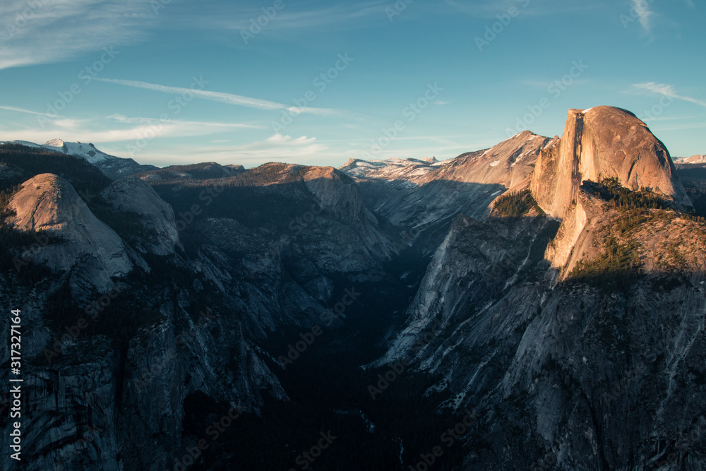 Last light of the day in the Yosemite Valley. Beautiful sunset over the Half Dome in one of the most gorgeous national parks of USA in California