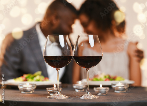 Two glasses of red wine on restaurant table