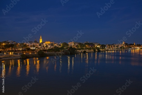 View of Seville historic center from the Bridge of Isabella II at night