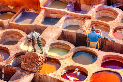 Leather dying in a traditional tannery in the city Fes, Morocco photo