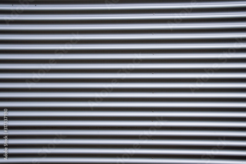 Corrugated iron fence for separation in silver